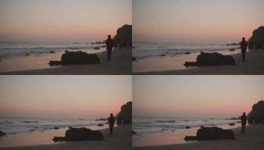 女人在黄昏时分的海滩散步高清在线视频素材下载