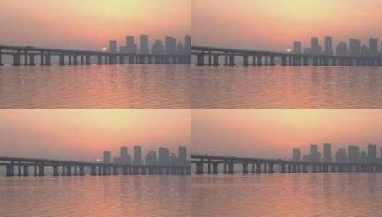 夕阳日落晚霞海岸线长堤海堤唯美城市高清在线视频素材下载