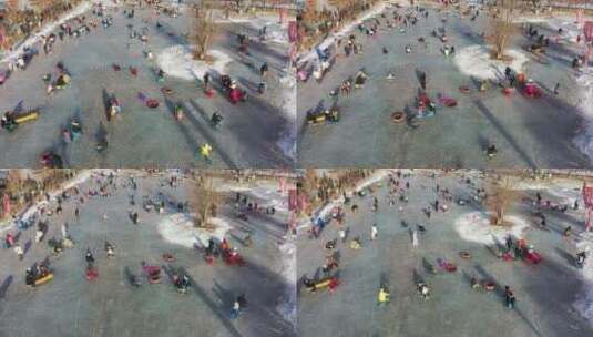 俯拍在冰上滑冰玩耍的人群高清在线视频素材下载