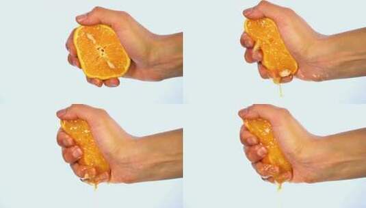 单手挤出鲜美的橙汁高清在线视频素材下载