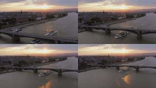 日落时分的河上的桥梁与船只高清在线视频素材下载