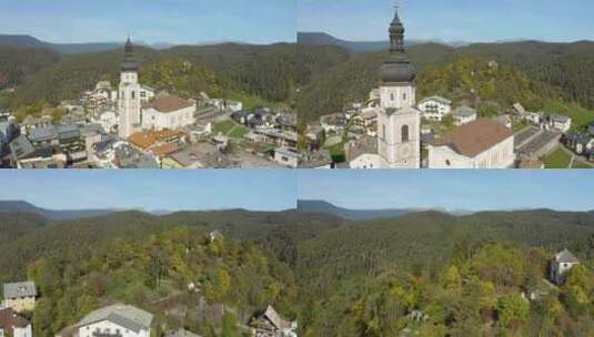 无人机飞过白云石小山村的教堂高清在线视频素材下载