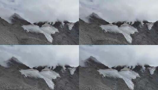 航拍云雾中的四川横断山脉乌库楚雪山风光高清在线视频素材下载