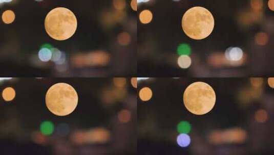 金色的月亮和城市的霓虹灯高清在线视频素材下载