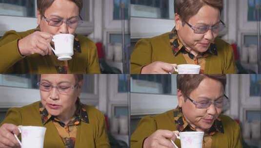 中老年女性手持茶杯高清在线视频素材下载