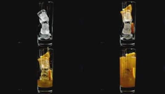 将冰和柠檬水倒入黑色背景的玻璃杯中高清在线视频素材下载