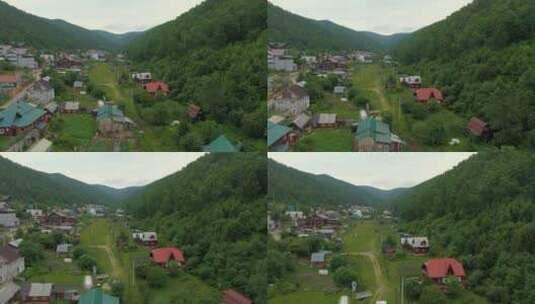 飞越森林山间的村庄高清在线视频素材下载