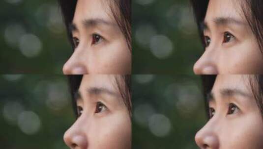 树林里的女孩的眼睛特写，明亮的眼睛高清在线视频素材下载