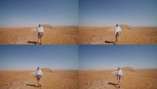 沙漠中行走的女人高清在线视频素材下载