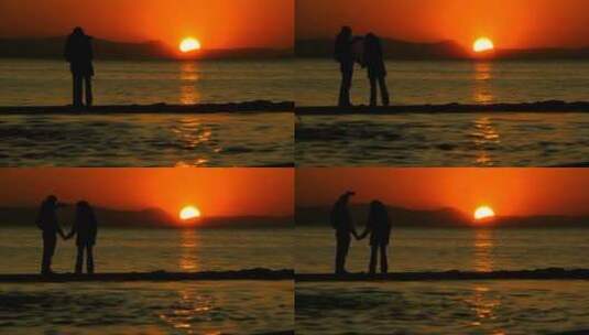 落日在湖水中央拍照的浪漫情侣高清在线视频素材下载