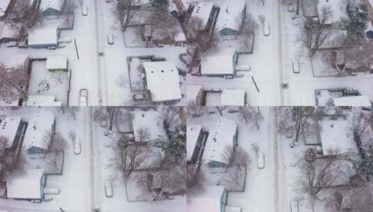 俯瞰白雪覆盖社区的鸟瞰图。高清在线视频素材下载