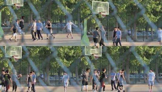 城市公园篮球场年轻人打篮球三步上篮慢动作高清在线视频素材下载