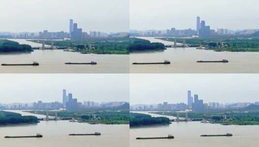 航拍轮船货轮航行长江江边堤岸润扬大桥高清在线视频素材下载
