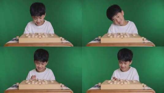中国小男孩在下棋中国象棋8K实拍高清在线视频素材下载
