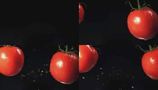 成熟的红色西红柿在黑色背景上飞行并碰撞高清在线视频素材下载