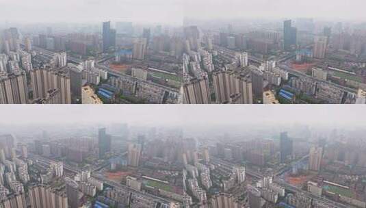 雨雾天，航拍武汉市云雾中的繁华城市上空高清在线视频素材下载