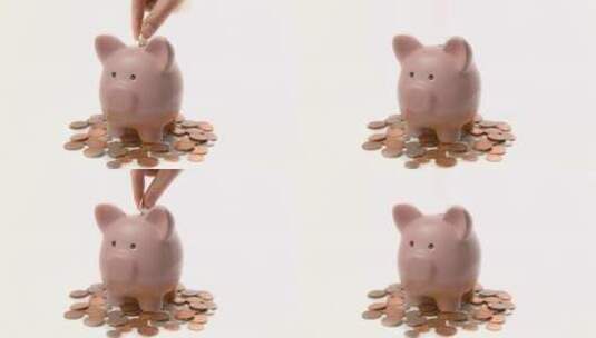 将硬币存入小猪存钱罐高清在线视频素材下载