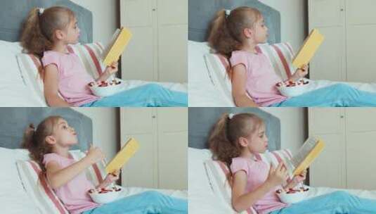 女孩看书吃糖果高清在线视频素材下载