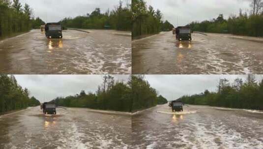 在被洪水淹没的道路上行驶的车辆高清在线视频素材下载