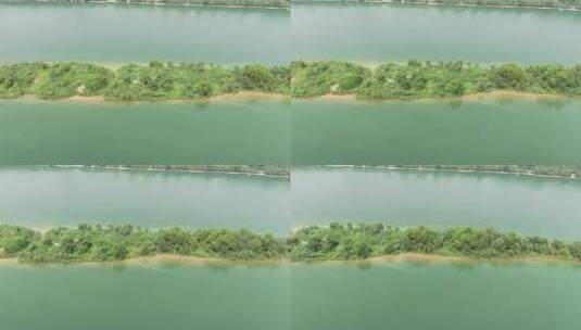 航拍江中绿色岛屿高清在线视频素材下载