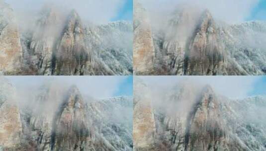 薄雾笼罩着白雪覆盖的山峰高清在线视频素材下载