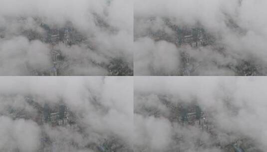 高空航拍云海中俯瞰城市建筑高清在线视频素材下载