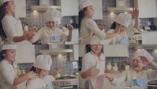 两个小女孩在厨房玩耍高清在线视频素材下载