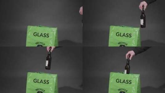 把玻璃瓶被丢弃入回收袋的特写镜头高清在线视频素材下载