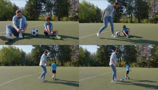父亲带小男孩踢足球高清在线视频素材下载