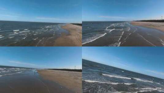 湛江海边沙滩玩耍的一家人航拍高清在线视频素材下载