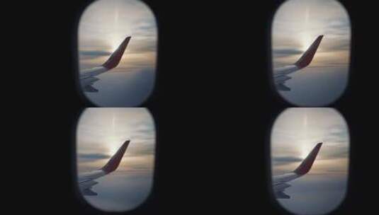 从飞机机翼上的窗户观看，在黎明或日落时在高空飞行时照射阳光高清在线视频素材下载