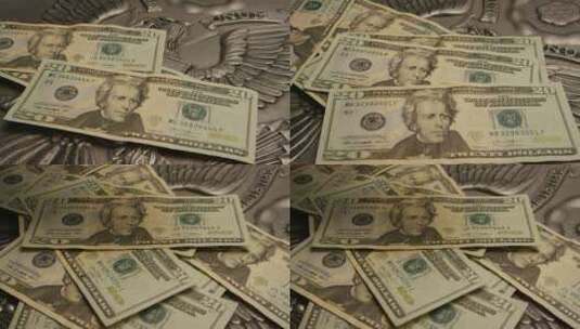 美国鹰盾背景上美国纸币的旋转镜头-MONEY 0392高清在线视频素材下载