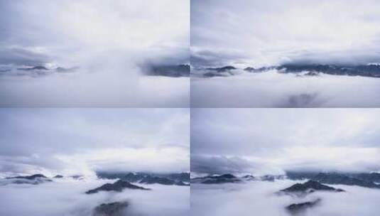 云海缭绕翻滚穿过山峰高清在线视频素材下载