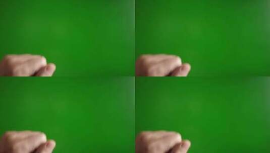 09.一个男人用手（张开）敲绿色背景高清在线视频素材下载