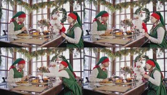 圣诞老人和精灵在用餐高清在线视频素材下载