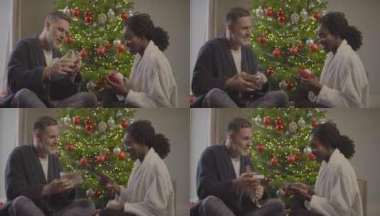 情侣一起拆开圣诞节礼物高清在线视频素材下载