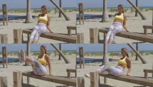女人在海滩上做健身运动高清在线视频素材下载