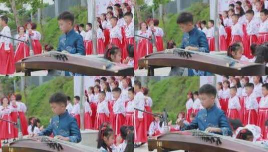 小学运动会上男孩弹古筝高清在线视频素材下载