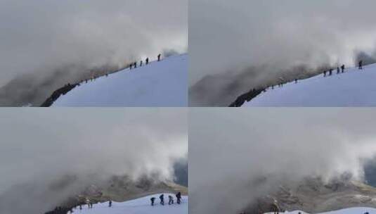 航拍攀登横断山脉乌库楚雪山的登山者高清在线视频素材下载
