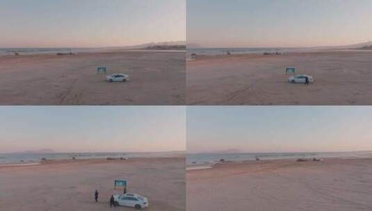 航拍4K海边驾车游玩自驾游沙滩傍晚海浪高清在线视频素材下载