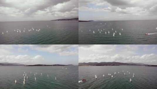 阴天在海上做帆船训练的帆船高清在线视频素材下载