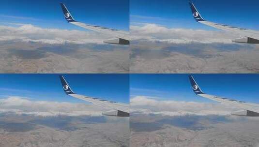 山东航空航班飞过祁连山脉雪山群峰高清在线视频素材下载