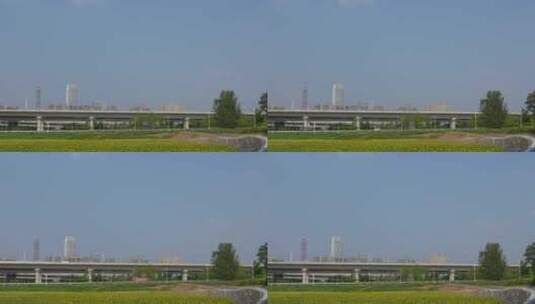 成都有花田前景的高铁道路与城市高清在线视频素材下载