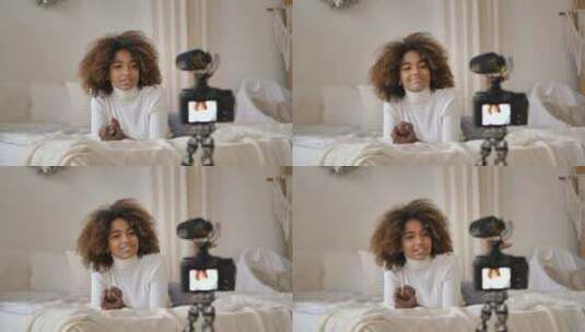 黑皮肤年轻博主拍摄躺在床上的美容博客高清在线视频素材下载