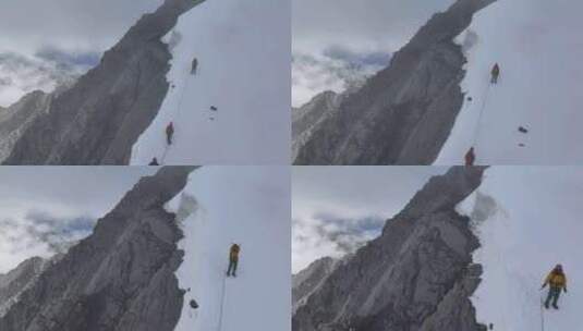 航拍攀登川西横断山脉乌库楚雪山的登山者高清在线视频素材下载