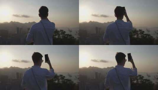 香港宝马山顶旅客夕阳下背影高清在线视频素材下载