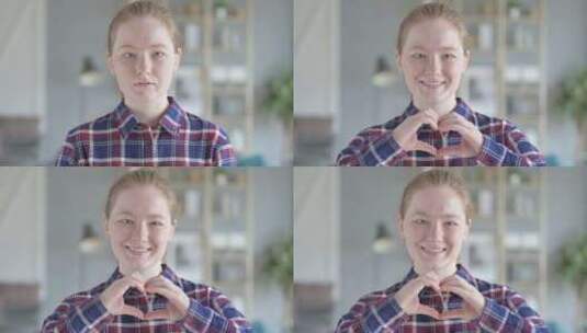 年轻女子用手做心脏的特写高清在线视频素材下载
