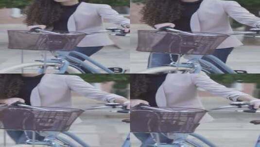 摩洛哥女士穿着休闲装骑自行车在户外散步日高清在线视频素材下载