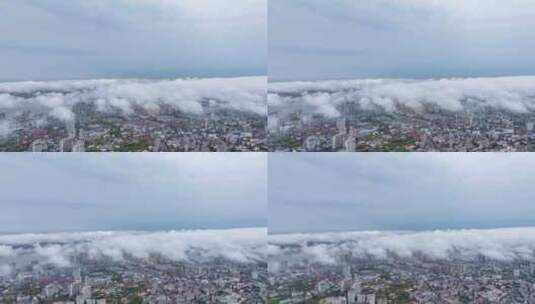 江西省九江市春季雨后烟云下的城市景观航拍高清在线视频素材下载