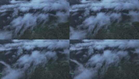 航拍四川甘孜稻城亚丁云雾缭绕的山脉景观高清在线视频素材下载